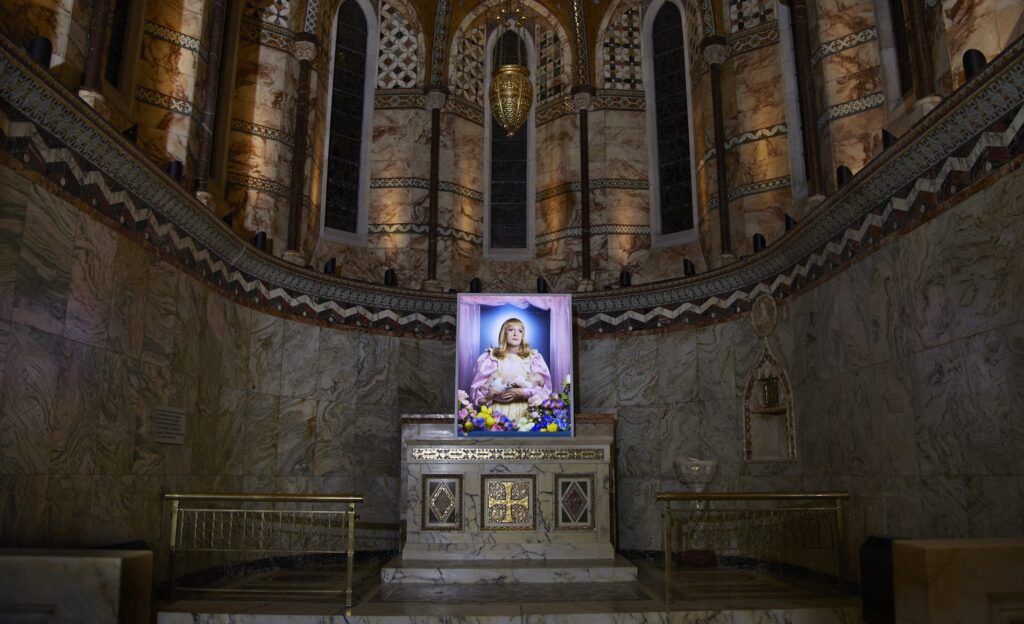 Created by renowned photographer Richard Ansett, this new portrait at the Fitzrovia Chapel focuses on Grayson Perry’s alter ego, Claire.  ‘Claire is not a natural mother. This is a trans-immaculate conception and a perfect synergy with The Fitzrovia Chapel.’ said Ansett of his new work ‘Birth’. The 60×40″ photographic portrait is produced onto Kodak Duratran, then reverse mounted on acrylic, […]