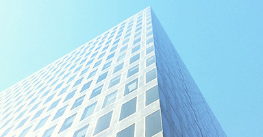 Photo of a city skyscraper looking up at the sky in the middle of the day. Supergloss paper, as noted by the name, has an ultra high glossy finish and is again best framed behind anti reflective glass.